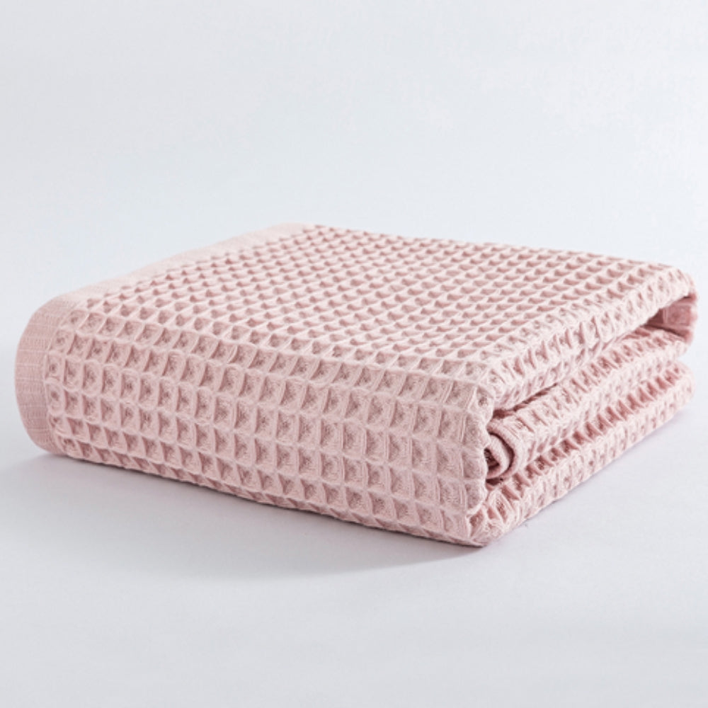 Waffle weave bath towel in pastel colors including pink, blue, white, and gray, ultra-absorbent and quick-drying