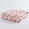 Waffle weave bath towel in pastel colors including pink, blue, white, and gray, ultra-absorbent and quick-drying
