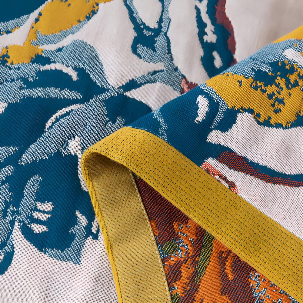 Soft decorative throw blanket with bold yellow and blue floral leaf print, lightweight cozy sofa couch cover