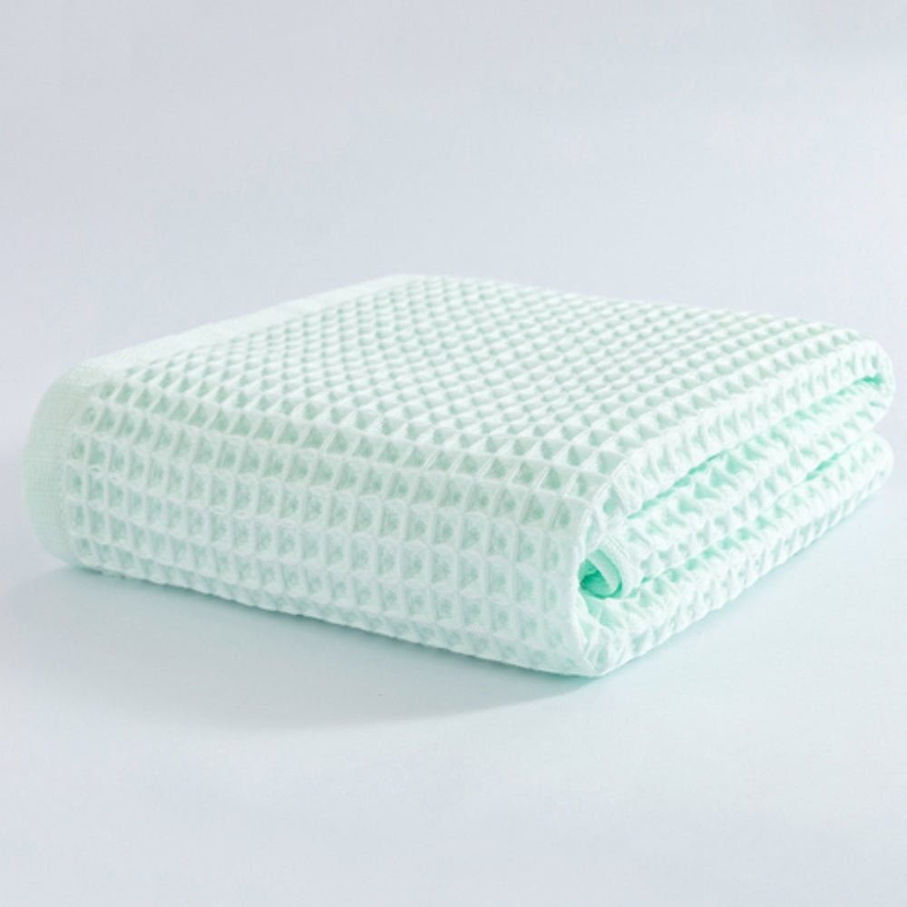 Waffle weave bath towel in pastel colors including pink, blue, white, and gray, ultra-absorbent and quick-drying