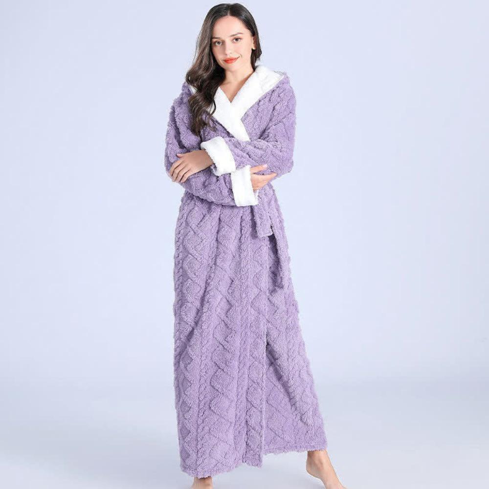 Women's long purple fleece bathrobe with hood, white trim, and textured chevron pattern, cozy winter loungewear
