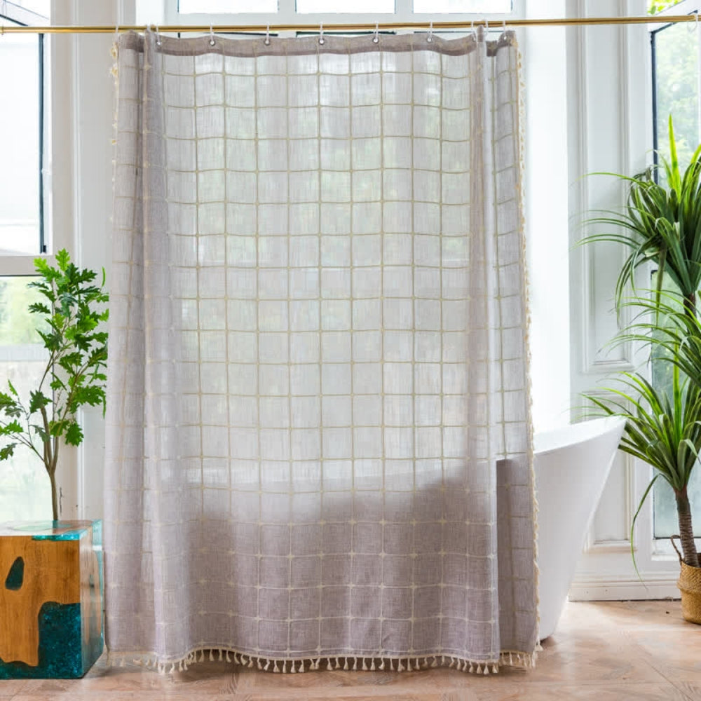 Light green sheer shower curtain with grid pattern and tassel trim, waterproof bathroom curtain for modern home decor