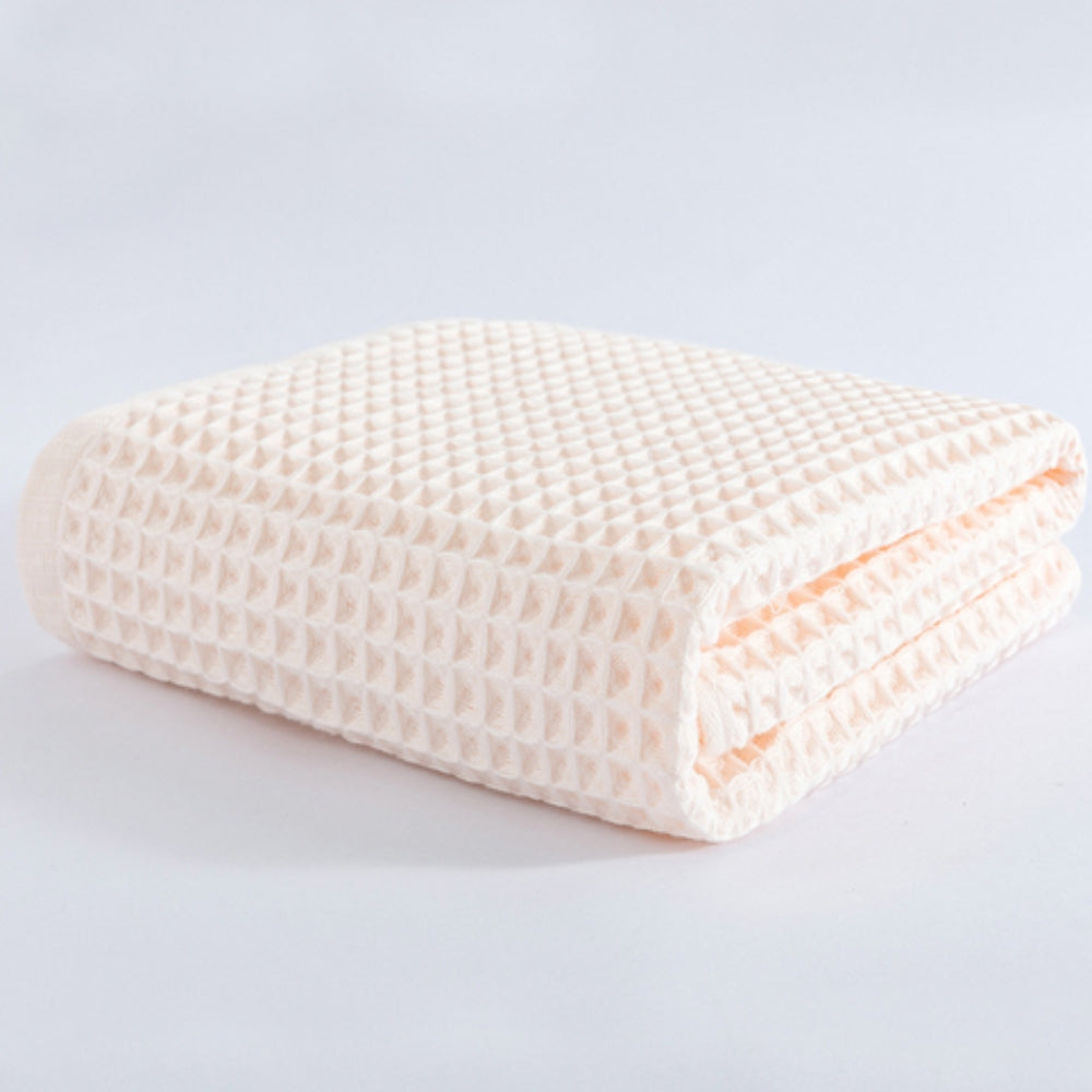 Waffle weave bath towel in pastel colors including pink, blue, white, and gray, ultra-absorbent and quick-drying
