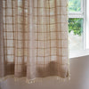 Light green sheer shower curtain with grid pattern and tassel trim, waterproof bathroom curtain for modern home decor