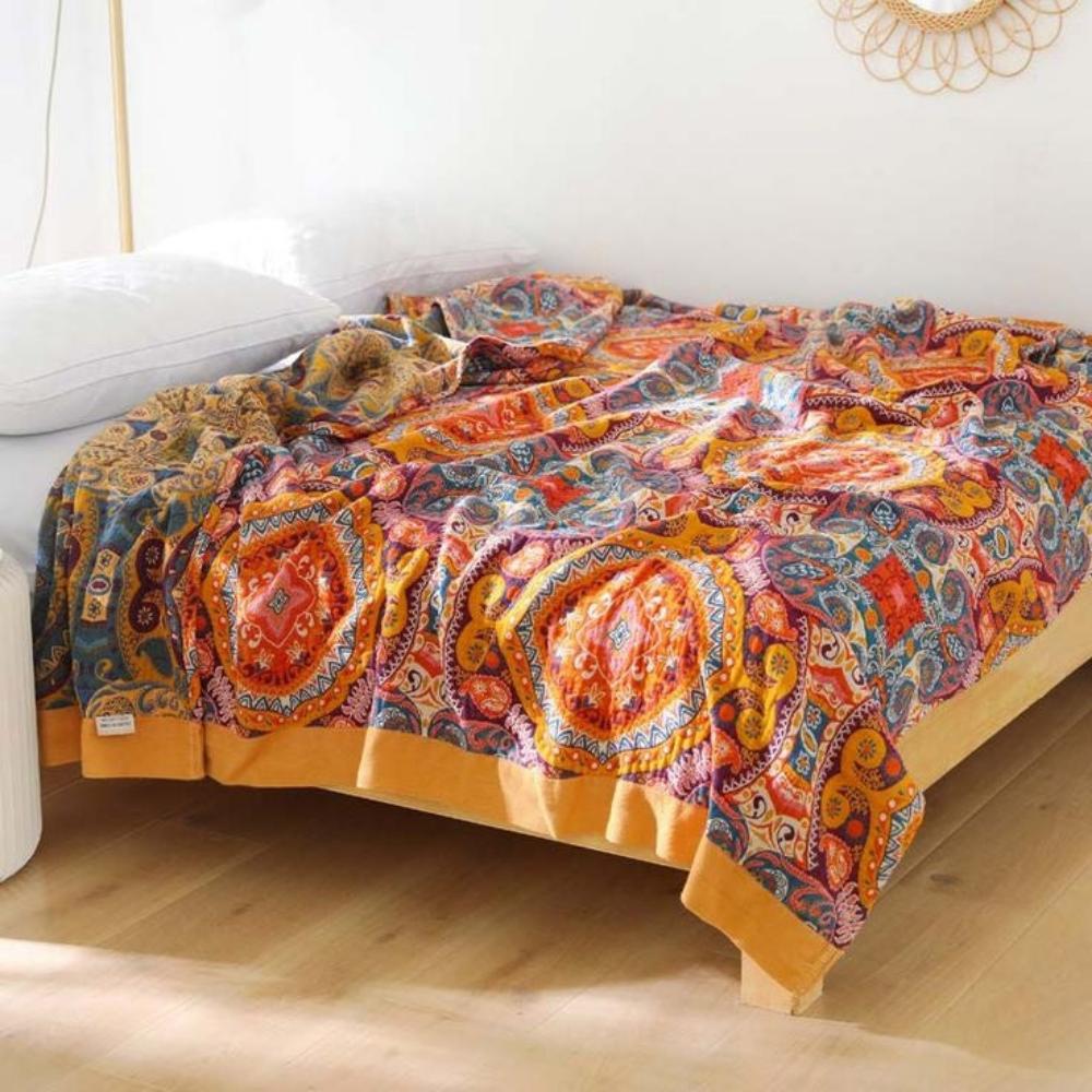 Bohemian patchwork quilt blanket with vibrant mandala and paisley patterns in orange, red, and blue – lightweight bedspread or throw
