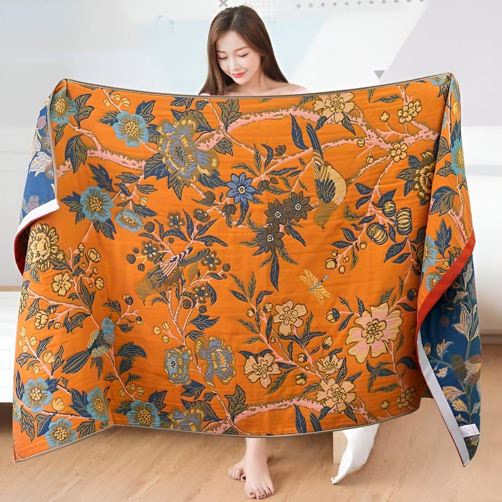 Floral throw blanket with orange background and blue yellow flower design, soft decorative sofa and bed cover