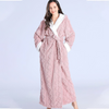 Women's long purple fleece bathrobe with hood, white trim, and textured chevron pattern, cozy winter loungewear