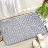 Dark brown bath mat with raised arch pattern, soft absorbent non-slip rug for bathroom floor and shower