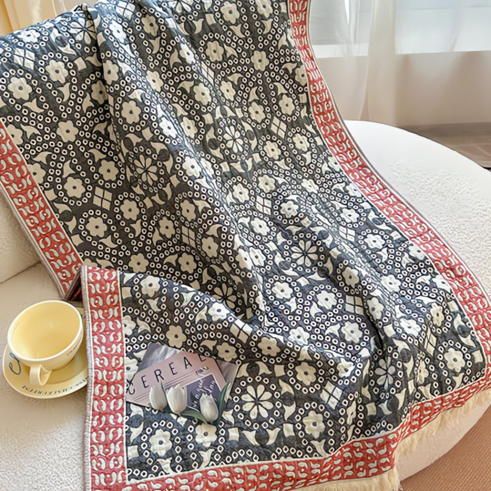 Soft throw blanket with Van Gogh inspired starry night design in blue and yellow, with fringe edges