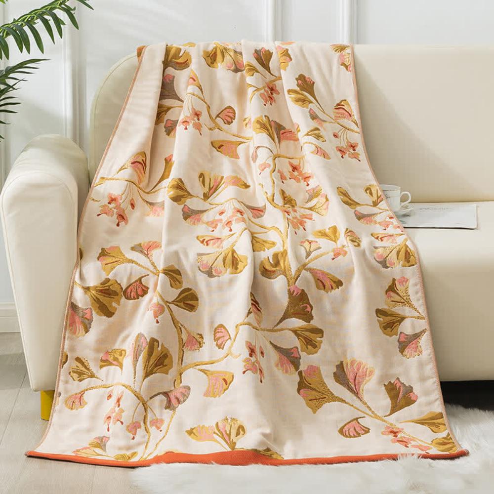 Elegant floral throw blanket with beige background and gold pink leaf design, soft decorative sofa and bed cover