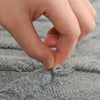 White geometric bath mat with diamond pattern, absorbent and non-slip plush rug for bathroom, shower, or tub