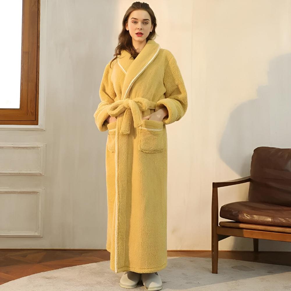Couple wearing matching long yellow fleece bathrobes with shawl collars, front pockets, and waist belts, cozy winter loungewear
