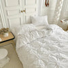 Luxury cream ruched bedding set with floral tufted design, soft cotton duvet cover and pillow shams for elegant bedroom decor
