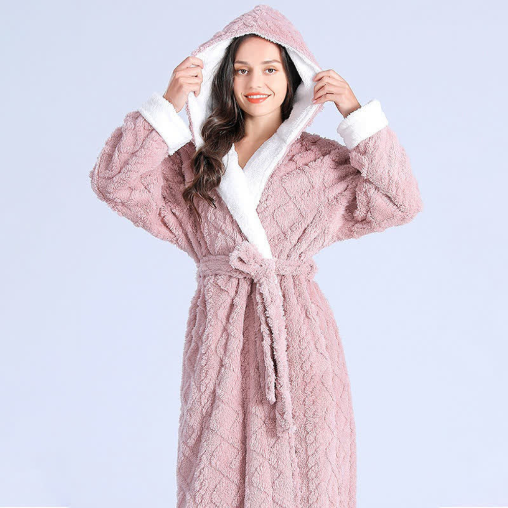 Women's long purple fleece bathrobe with hood, white trim, and textured chevron pattern, cozy winter loungewear