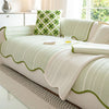 Green and white striped sofa cover with scalloped edges, modern couch protector and decorative throw blanket for living room