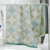 Light green and white throw blanket with modern fan circle pattern, soft decorative accent for sofa or bed