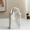 Handbag vase – Ceramic and porcelain blend – Playful handbag design – Chic home decor accessory