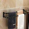 Wall-mounted black metal towel rack with multi-bar design, space-saving bathroom organizer for towels and linens
