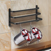 Wall-mounted black metal towel rack with multi-bar design, space-saving bathroom organizer for towels and linens