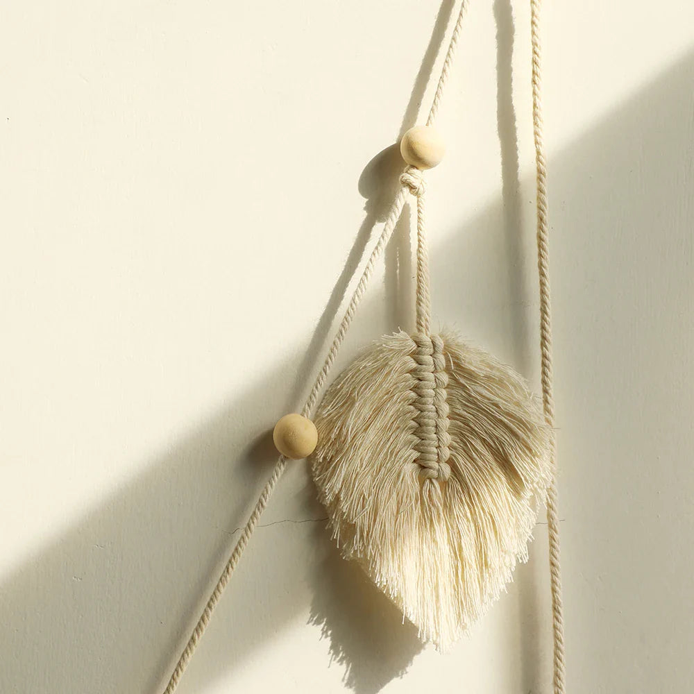 Handmade macrame leaf garland wall hanging with natural cotton rope and wooden beads for boho home decor