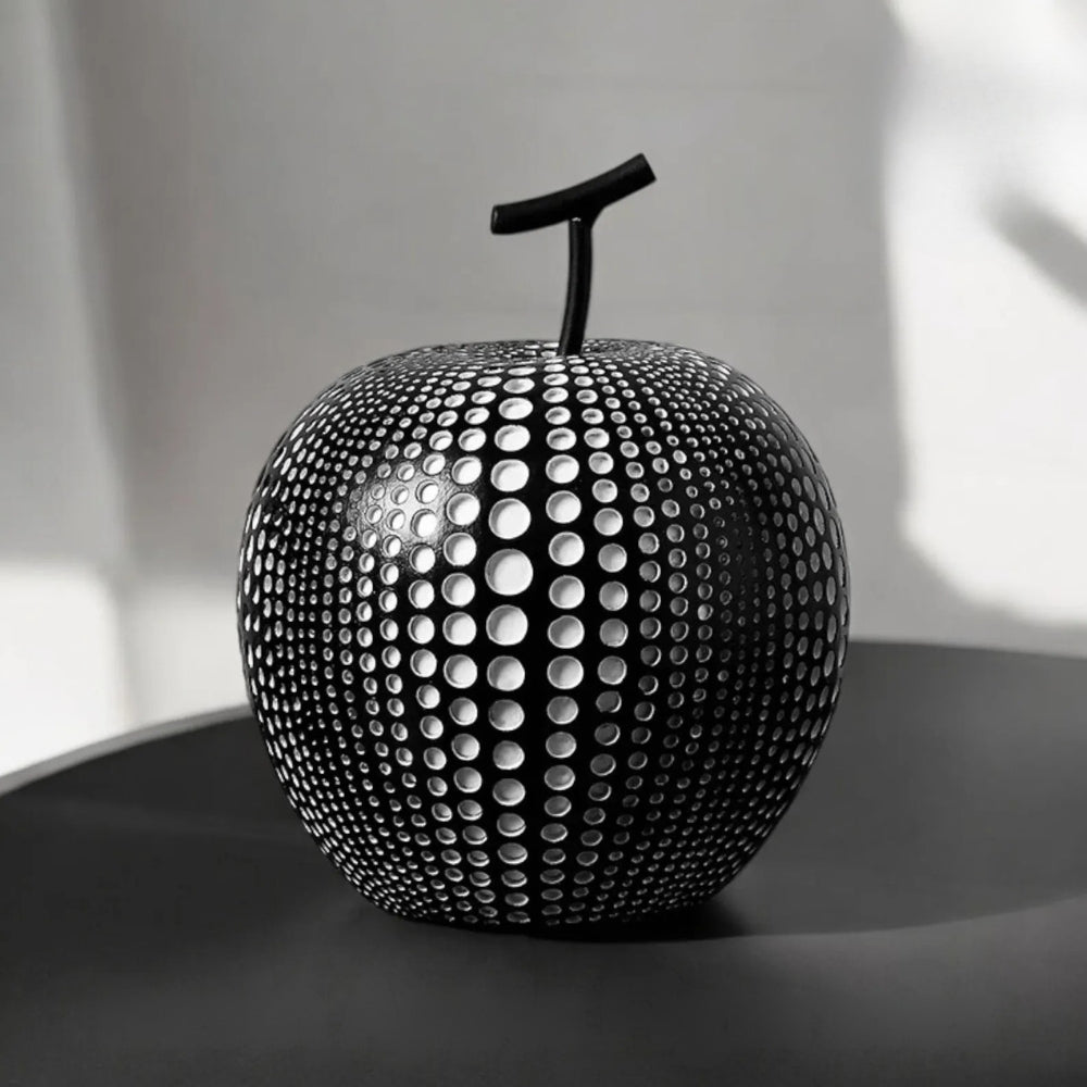 Modern black and white apple sculpture decor with polka dot design, contemporary resin ornaments for living room or office display