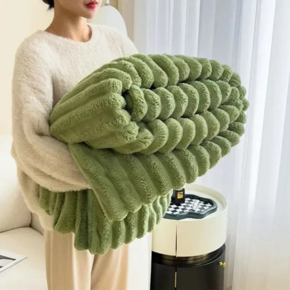 Plush grey faux fur throw blanket with ribbed texture, soft and warm decorative couch or bed cover