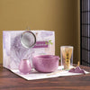 Japanese matcha tea whisk with purple cherry blossom bowl, traditional bamboo chasen for green tea ceremony