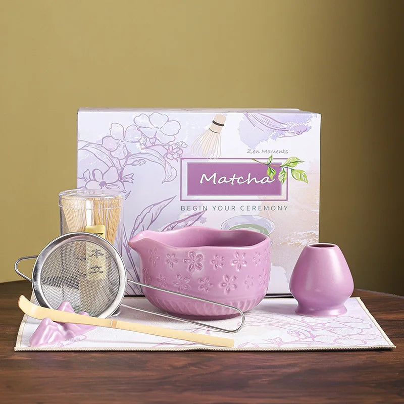 Japanese matcha tea whisk with purple cherry blossom bowl, traditional bamboo chasen for green tea ceremony