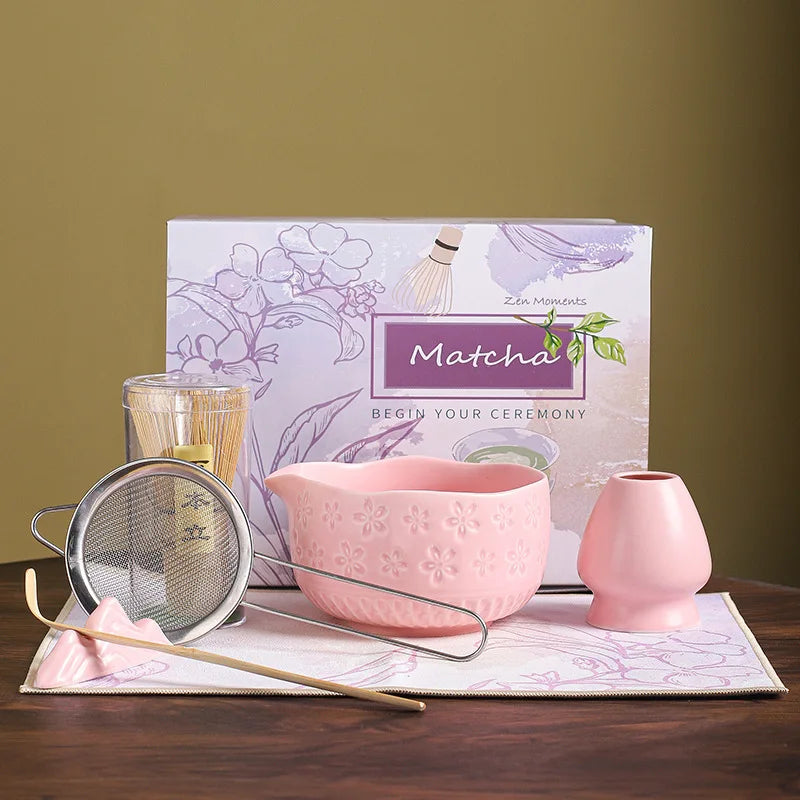 Japanese matcha tea whisk with purple cherry blossom bowl, traditional bamboo chasen for green tea ceremony