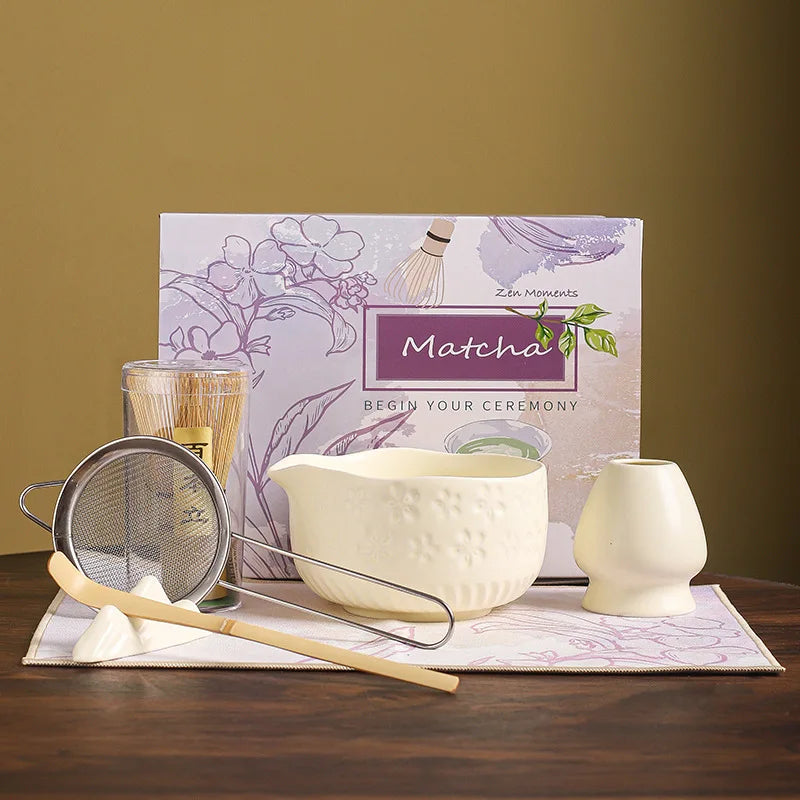 Japanese matcha tea whisk with purple cherry blossom bowl, traditional bamboo chasen for green tea ceremony