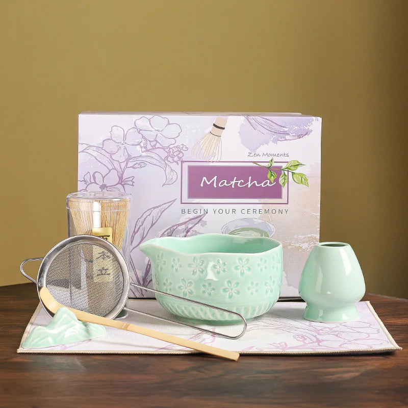 Japanese matcha tea whisk with purple cherry blossom bowl, traditional bamboo chasen for green tea ceremony