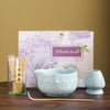 Japanese matcha tea whisk with purple cherry blossom bowl, traditional bamboo chasen for green tea ceremony