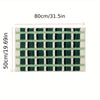 Anti-slip bathroom rug with green and white plaid checkered design, soft absorbent bath mat for modern bathroom decor