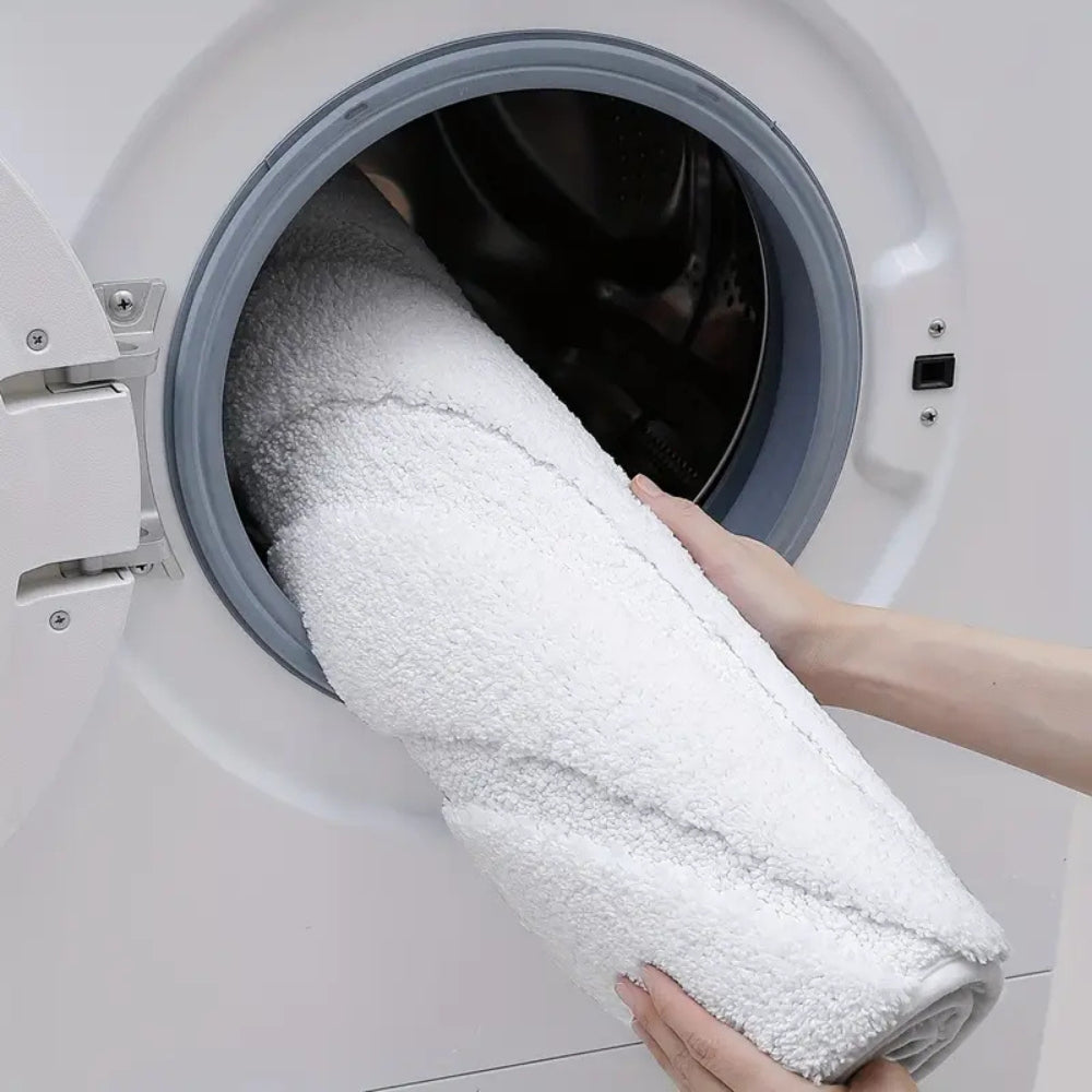 Anti-slip white bathroom rug with modern geometric embossed pattern, soft absorbent bath mat for bathroom and shower area