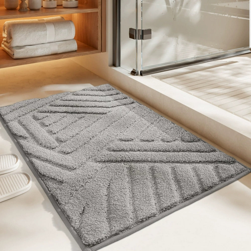 Anti-slip white bathroom rug with modern geometric embossed pattern, soft absorbent bath mat for bathroom and shower area
