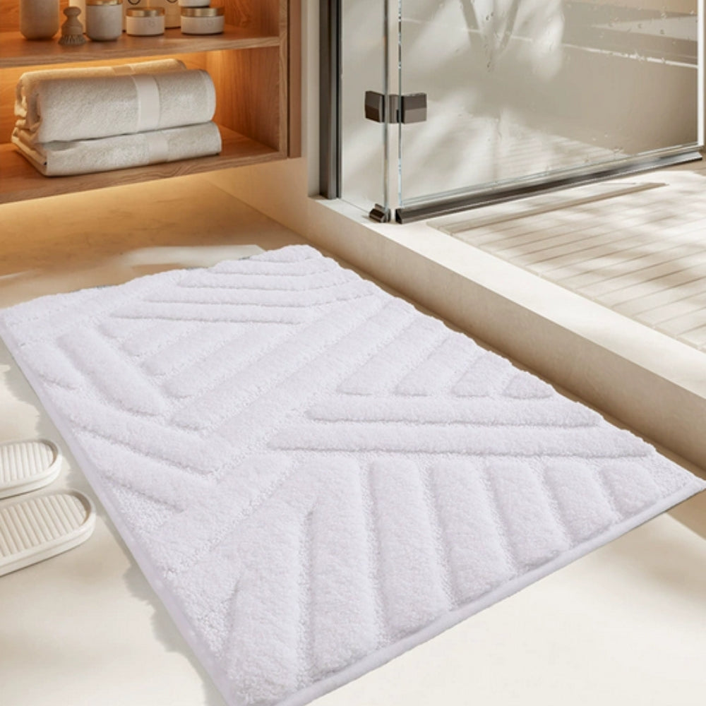 Anti-slip white bathroom rug with modern geometric embossed pattern, soft absorbent bath mat for bathroom and shower area