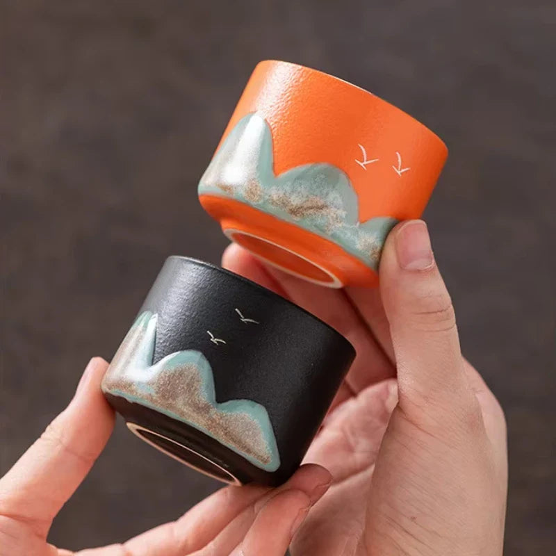 Set of four ceramic Chinese tea cups with hand-painted mountain design, gift box for traditional gongfu tea ceremony
