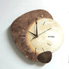 Modern LED wall clock with abstract stone design and golden deer, decorative timepiece for living room or office decor