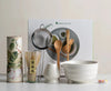 Japanese matcha set with white ceramic tea bowl and pink cherry blossom design, bamboo whisk, sifter, and tea scoop for traditional tea ceremony