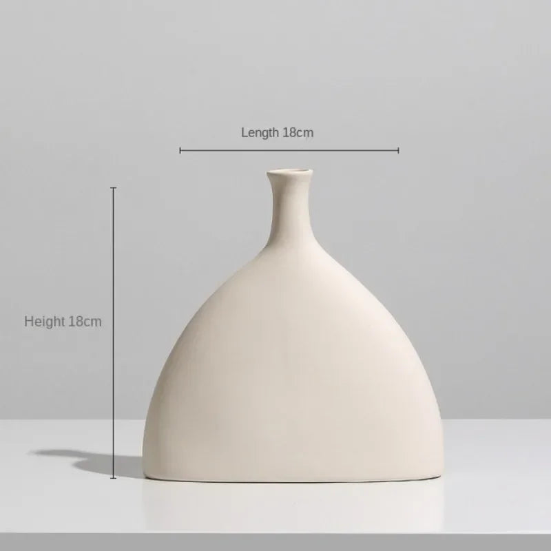 Set of modern abstract ceramic vases in matte beige, minimalist home decor for living room or dining table display