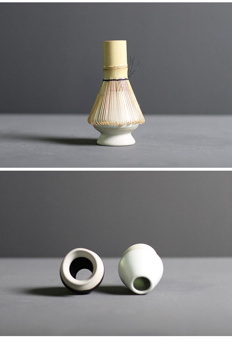 Minimalist Japanese matcha set with black ceramic tea bowl, bamboo whisk, whisk holder, and bamboo tea scoop for authentic tea ceremony
