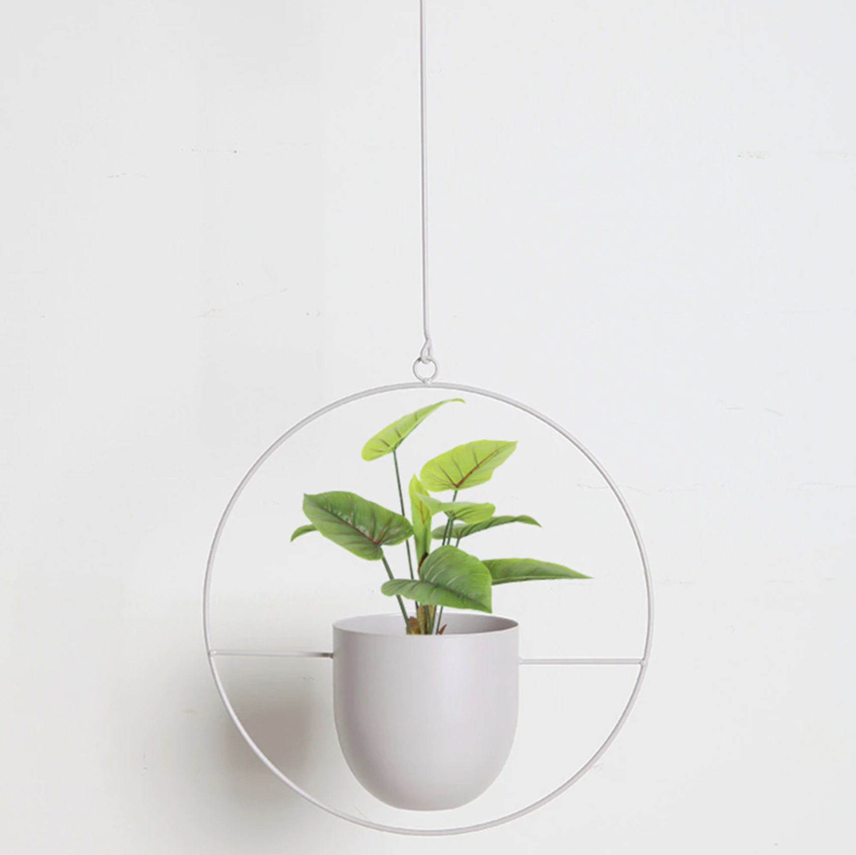 Set of modern hanging metal planters with geometric frames, indoor wall plant holders for home and balcony decor