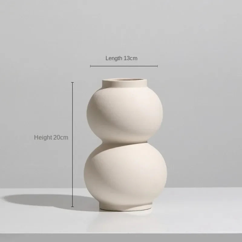 Set of modern abstract ceramic vases in matte beige, minimalist home decor for living room or dining table display