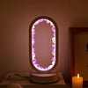 Amethyst crystal LED table lamp with oval frame, ambient night light for bedroom or meditation space decor