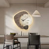Modern LED wall clock with abstract stone design and golden deer, decorative timepiece for living room or office decor