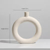 Set of modern abstract ceramic vases in matte beige, minimalist home decor for living room or dining table display