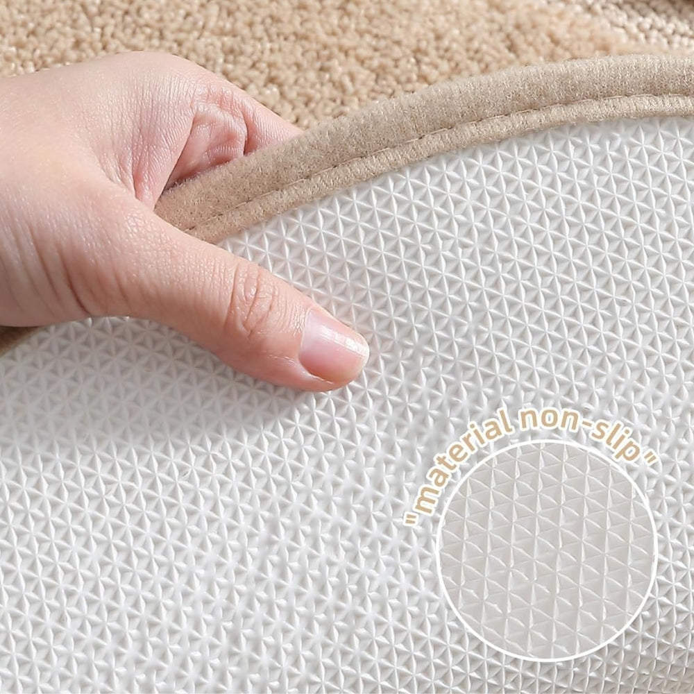 Beige oval bathroom rug, soft absorbent bath mat with non-slip backing, plush microfiber floor rug for tub or shower