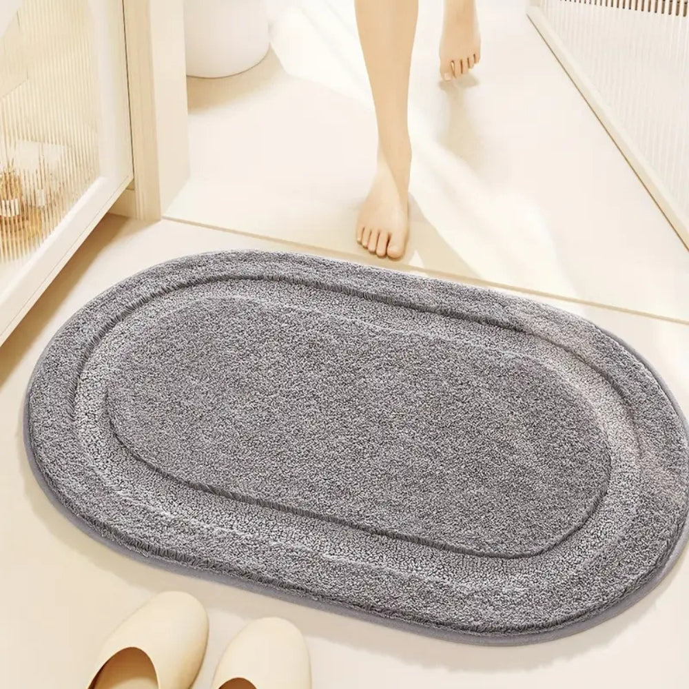Beige oval bathroom rug, soft absorbent bath mat with non-slip backing, plush microfiber floor rug for tub or shower