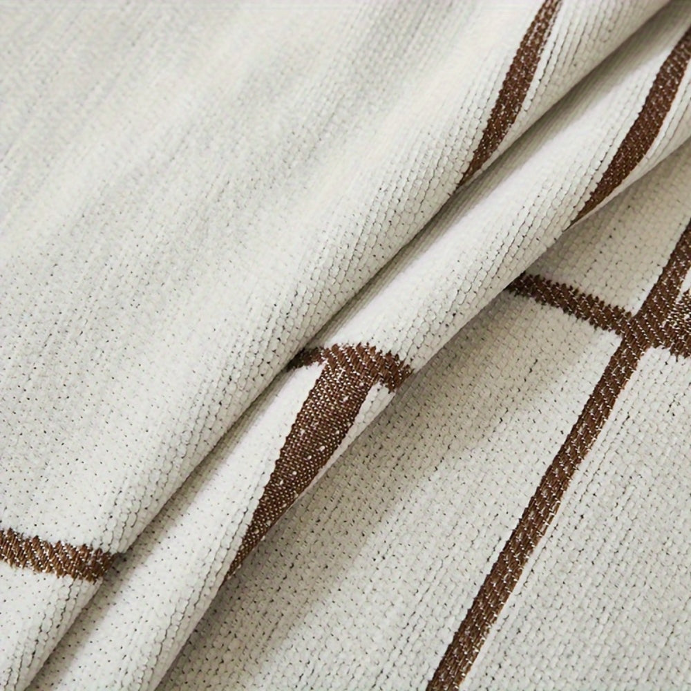 Modern geometric grey and white sofa cover with abstract wave pattern and fringe edges – washable couch slipcover for living room furniture protection
