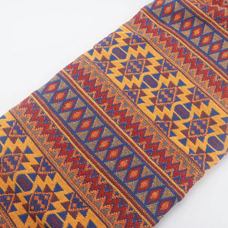 Throw blanket – Cotton-poly blend – Earthy tribal pattern – Reversible design – Cozy home accessory